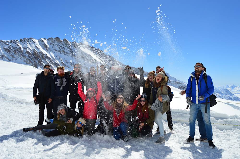 Travellers enjoying a snowy winter landscape in Pakistan